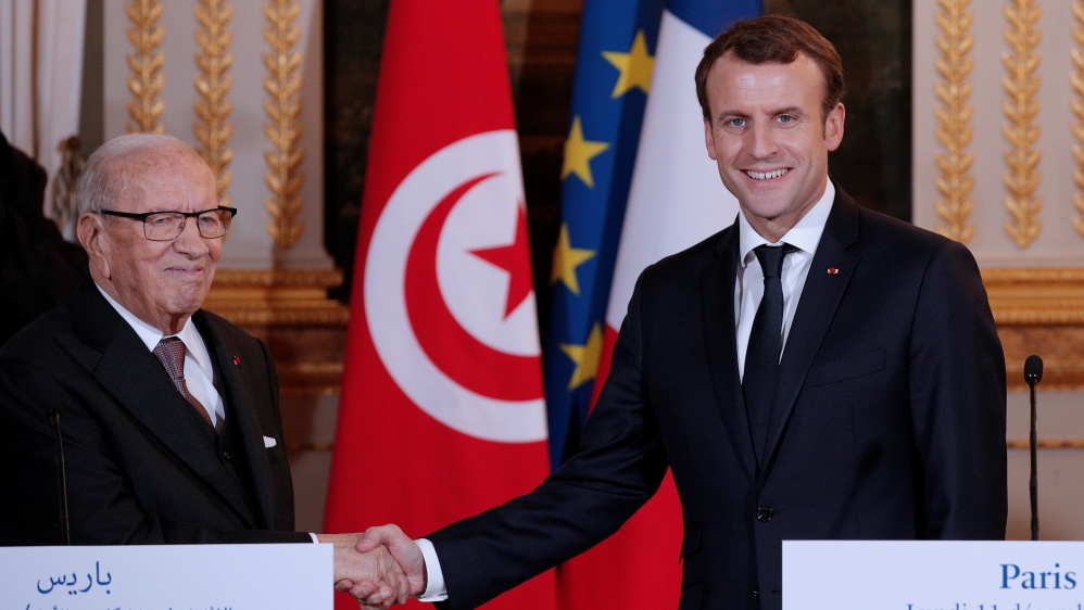 Macron met his Tunisian counterpart, Beji Caid Essebsi, in Paris last December [Yoan Valat/Reuters]
