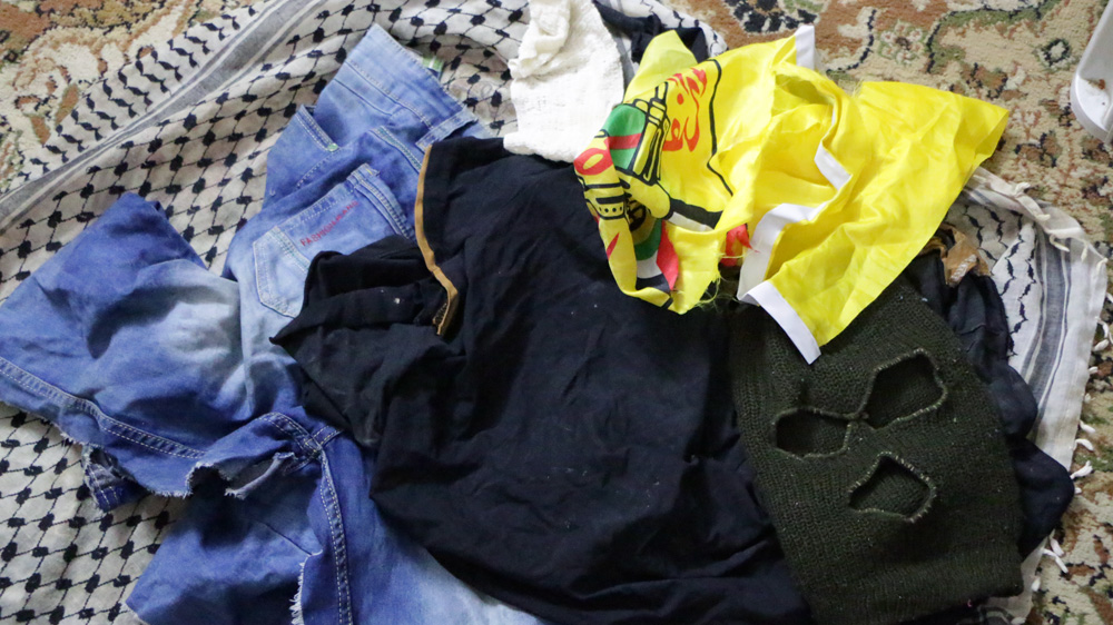 Ahmad Sharaka's clothes worn the day he was killed [Ylenia Gostoli/Al Jazeera]