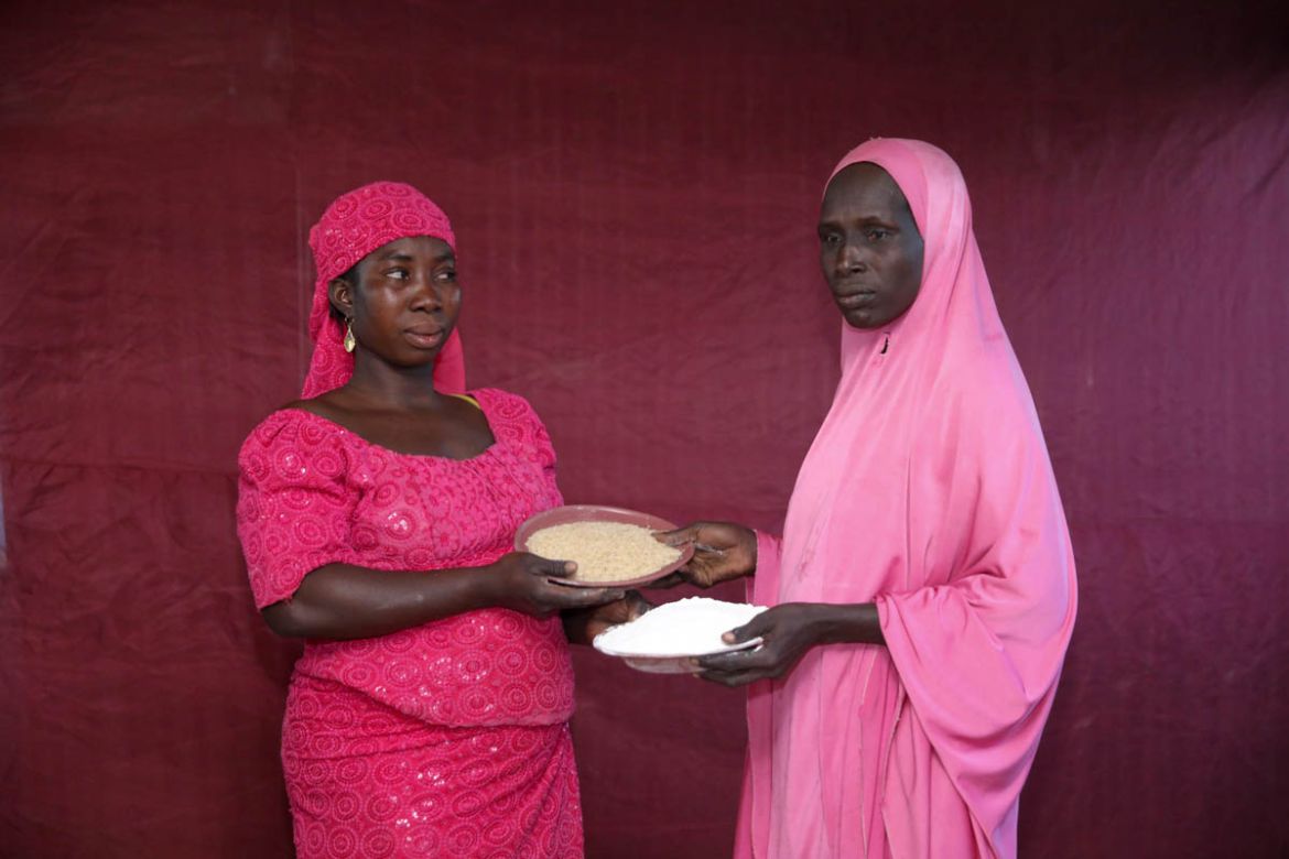Falmata Madu exchanges her plate of uncooked rice for Hadisa Adamu''s ground maize. Many of those responding to the crisis are also concerned that with economic prospects dim for the foreseeable future