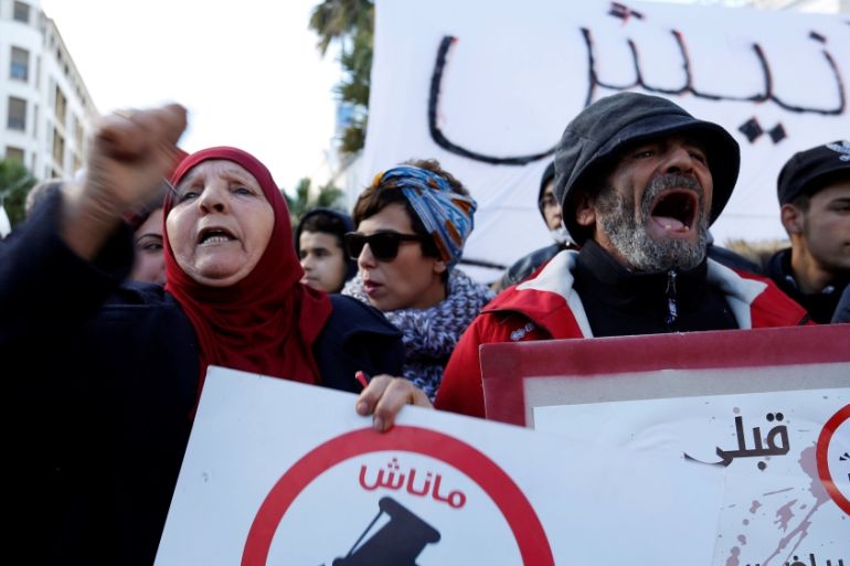 Protesters shout slogans against rising prices and tax increases in Tunis