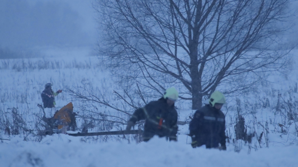 Emergency services arrived at the crash site on foot [Maxim Shemetov/Reuters]