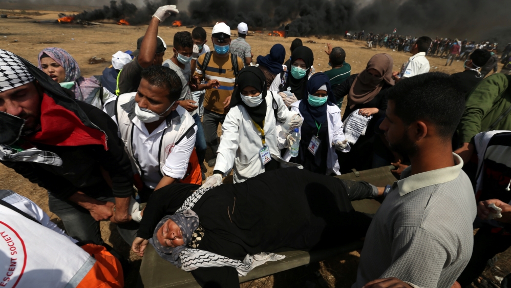 
A female demonstrator is evacuated after inhaling tear gas fired by Israeli troops at the Israel-Gaza border [Ibraheem Abu Mustafa/Reuters]









Palestinian protesters run from tear gas launched by Israeli forces during the Great March of Return in Khan Younis in the southern Gaza Strip [Mustafa Hassona/Anadolu Agency]  








Palestinians shout slogans as they protested on Friday [Mustafa Hassona/Anadolu Agency]












Palestinian protesters run from tear gas launched by Israeli forces during the Great March of Return in Khan Younis in the southern Gaza Strip [Mustafa Hassona/Anadolu Agency]  








Palestinians shout slogans as they protested on Friday [Mustafa Hassona/Anadolu Agency]





Palestinians shout slogans as they protested on Friday [Mustafa Hassona/Anadolu Agency]
