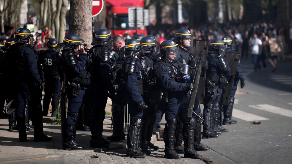 The march in Paris was marred by occasional clashes between police and far-left groups [Reuters]