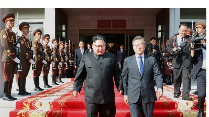 South Korean President Moon Jae-in and North Korean leader Kim Jong Un leave after their summit at the truce village of Panmunjom, North Korea [The Presidential Blue House via Reuters]