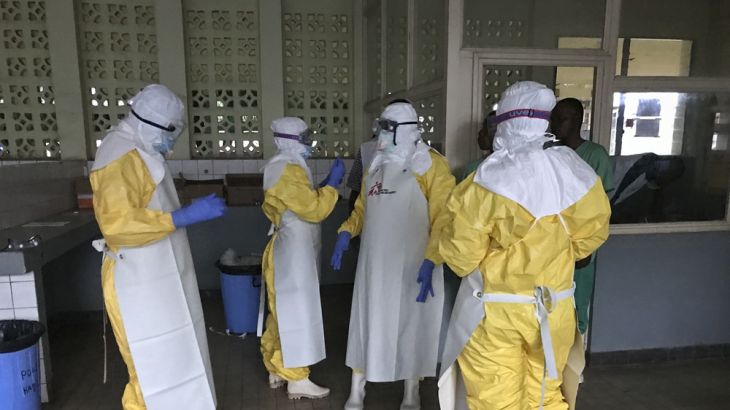 Sunday, May 20, 2018 - a team from Medecins Sans Frontieres dons protective clothing and equipment as they prepare to treat Ebola patients [Louise Annaud/Medecins Sans Frontieres via AP]