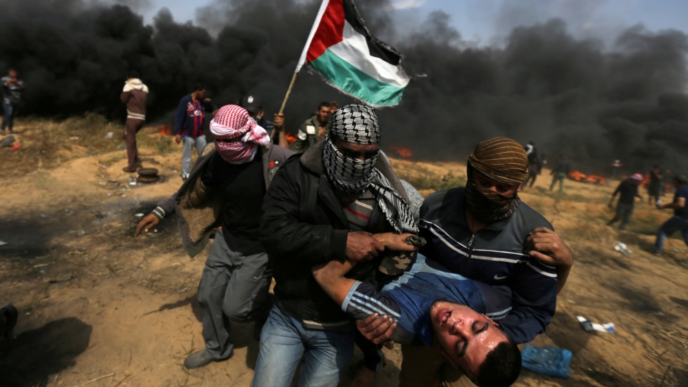 A wounded demonstrator is evacuated at a recent March of Great Return protest, where Palestinians demand the right to return to their homeland [Ibraheem Abu Mustafa/Reuters]