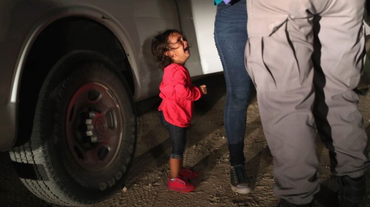 MCALLEN, TX - JUNE 12: A two-year-old Honduran asylum seeker cries as her mother is searched and detained near the U.S.-Mexico border on June 12, 2018 in McAllen, Texas. The asylum seekers had rafted