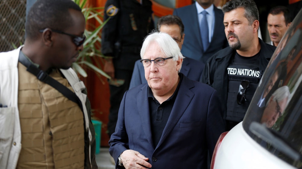 UN envoy to Yemen Martin Griffiths was escorted by bodyguards as he arrived at Sanaa airport on June 16 [Khaled Abdullah/Reuters]