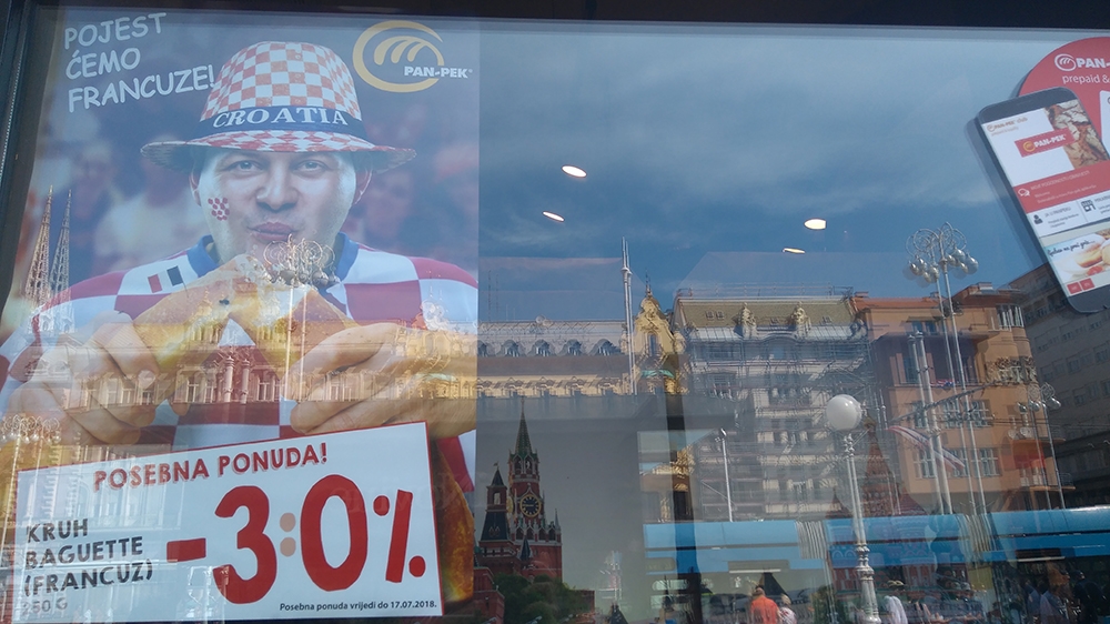 A bakery in Zagreb offering a discount on 'francuz' (the Frenchman), with a poster reading 'We will eat the French for lunch' [Jelena Prtoric/Al Jazeera]