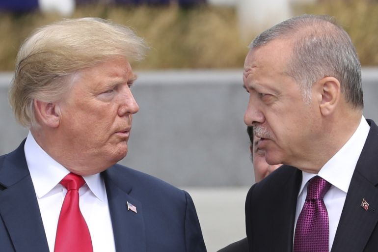 U.S. President Donald Trump, left, talks to Turkish President Recep Tayyip Erdogan, right