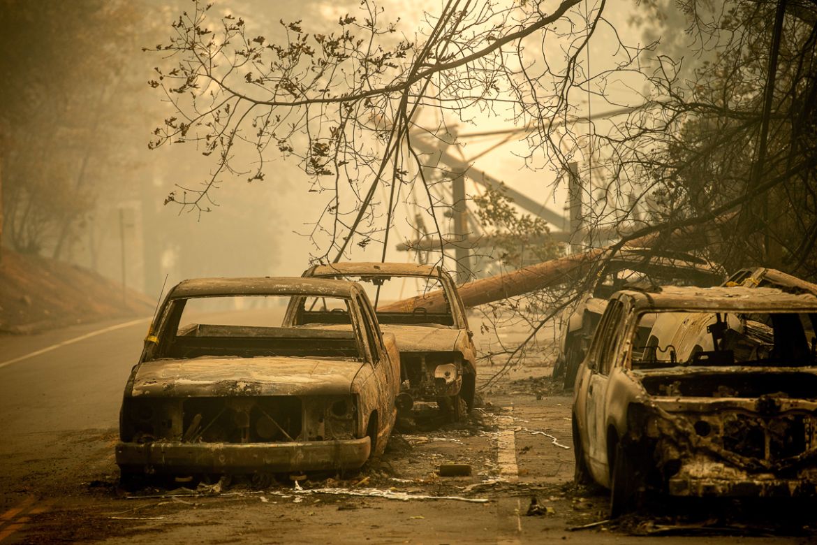 Abandoned cars, scorched by the wildfire, line Pearson Rd. in Paradise, Calif., on Saturday, Nov. 10, 2018. Not much is left in Paradise after a ferocious wildfire roared through the Northern Californ