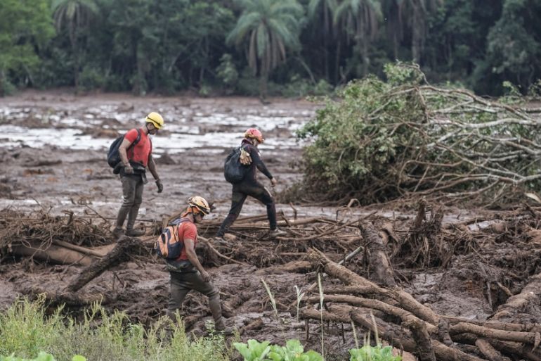 Firefighters search the mud, after a dam collapse near Brumadinho, Brazil, Saturday, Jan. 26, 2019. Rescuers in helicopters on Saturday searched for survivors while firefighters dug through mud in a h