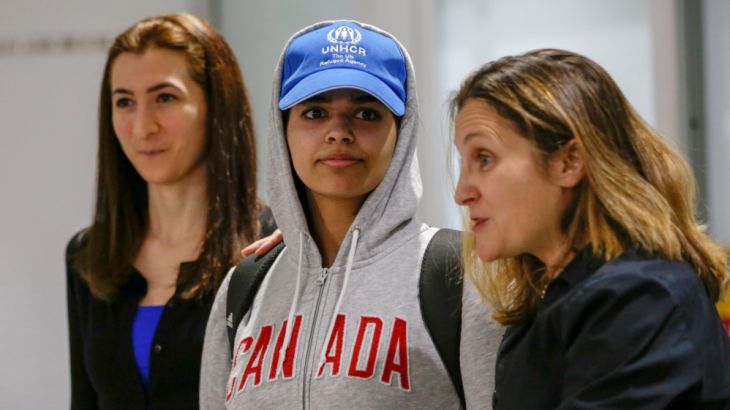 Rahaf Mohammed al-Qunun (C) accompanied by Canadian Minister of Foreign Affairs Chrystia Freeland (R) and Saba Abbas, general counsellor of COSTI refugee service agency