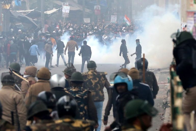 Protesters clash with security forces during a protest against Citizen Amendment Act (CAA) in New Delhi, India, 17 December 2019. According to news reports, few vehicles were set ablaze by the protest