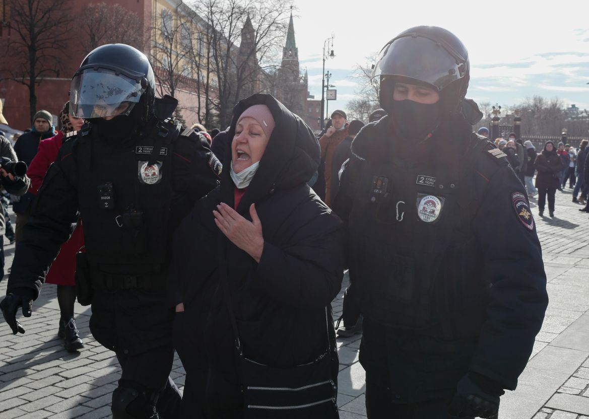 Russian policemen arrest a participant in an unauthorized rally against the Russian invasion of Ukraine, in downtown Moscow