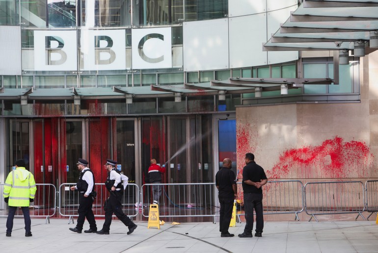 Police officers walk outside the BBC building, near where a march for a protest in solidarity with Palestinians is set to begin, covered in red paint, amid the ongoing conflict between Israel and the Palestinian Islamist group Hamas, in London, Britain, October 14, 2023. REUTERS/Susannah Ireland