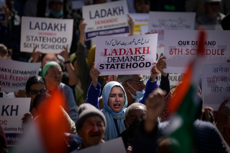 Residents from Ladakh hold placards demanding statehood and other democratic rights for their region during a protest in New Delhi, India,
