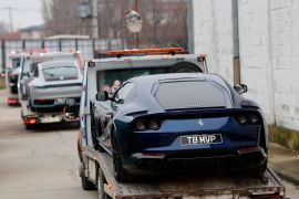 A car with the number plate &#039;T8 MVP&#039; belonging to Andrew Tate being towed away by Romanian authorities [File: Robert Ghement/EPA-EFE]