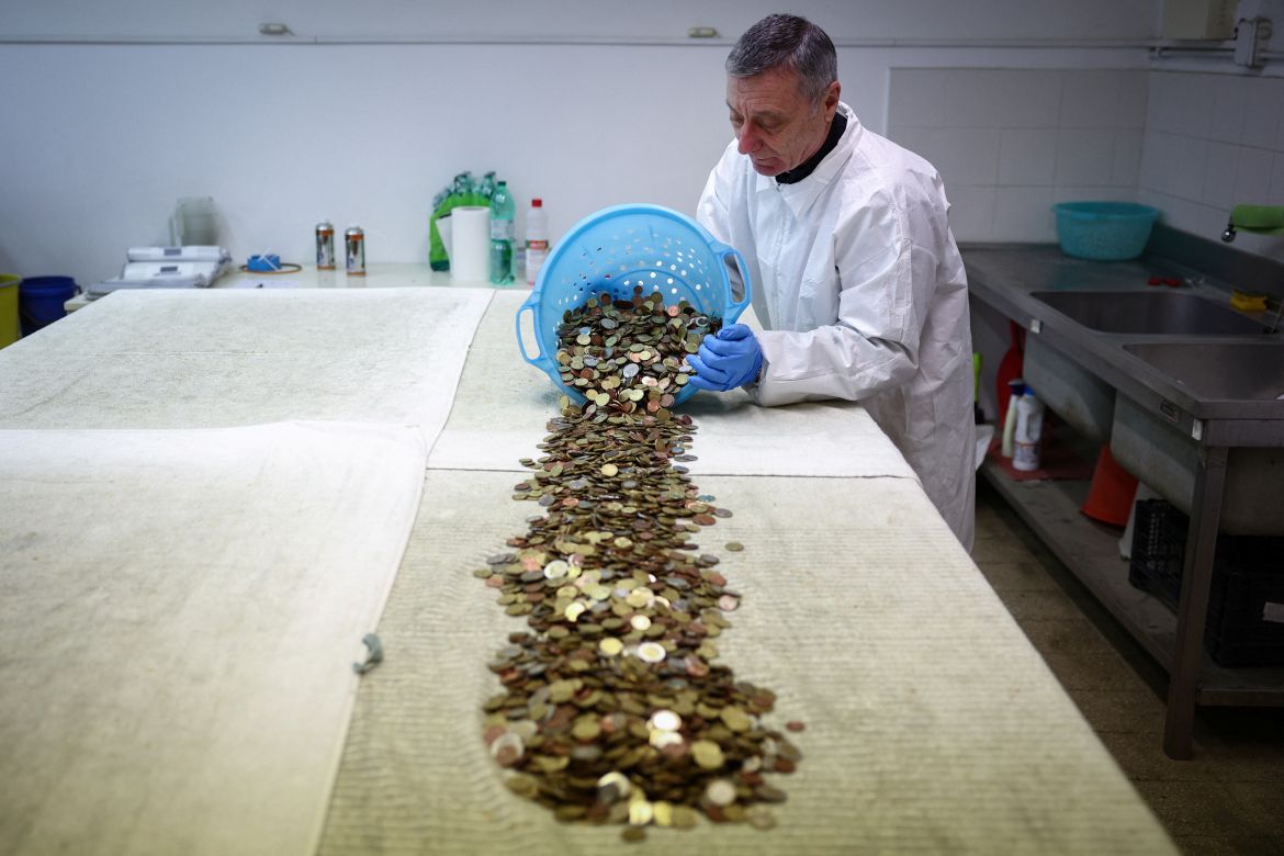 Coins are pictured after having been collected from the Trevi Fountain
