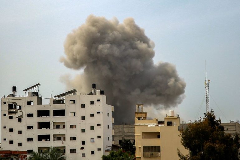Smoke rises above buildings during an Israeli strike in the vicinity of the al-Shifa hospital in Gaza City