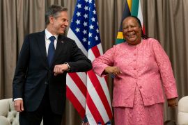 US Secretary of State Antony Blinken is greeted by South Africa&#039;s Foreign Minister Naledi Pandor as he arrives for a meeting at the South African Department of International Relations in 2022 [File: Andrew Harnik/AP Pool]