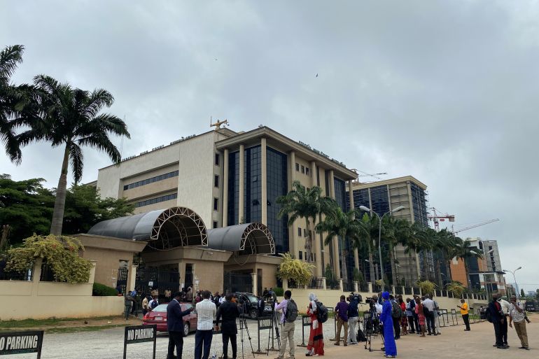 Journalists are seen stationed opposite the Federal High Court as they await the arrival of IPOB leader Nnamdi Kanu at the court in Abuja, Nigeria, July 26, 2021. REUTERS/Abraham Achirga