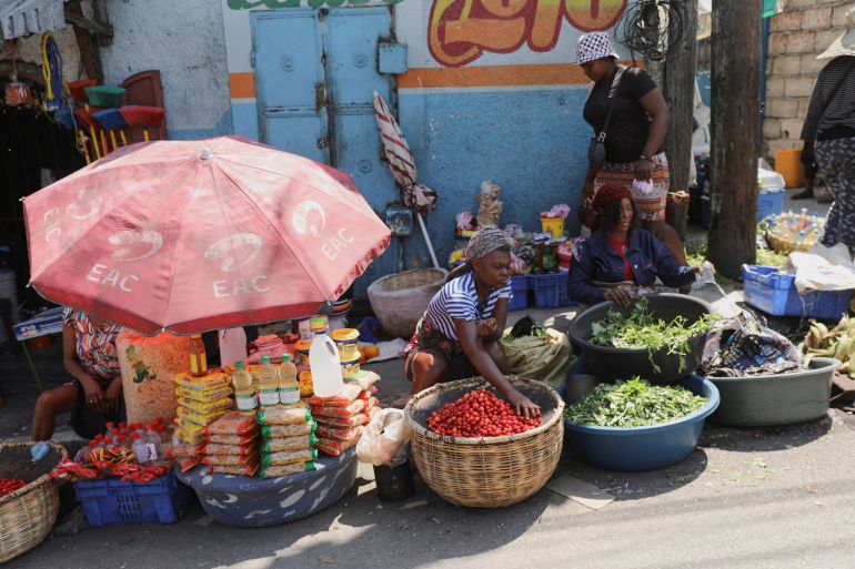 Street vendors offer produce at a market after Haiti's Prime Minister Ariel Henry pledged to step down after months of escalating gang violence, in Port-au-Prince, Haiti March 12, 2024. REUTERS/Ralph Tedy Erol