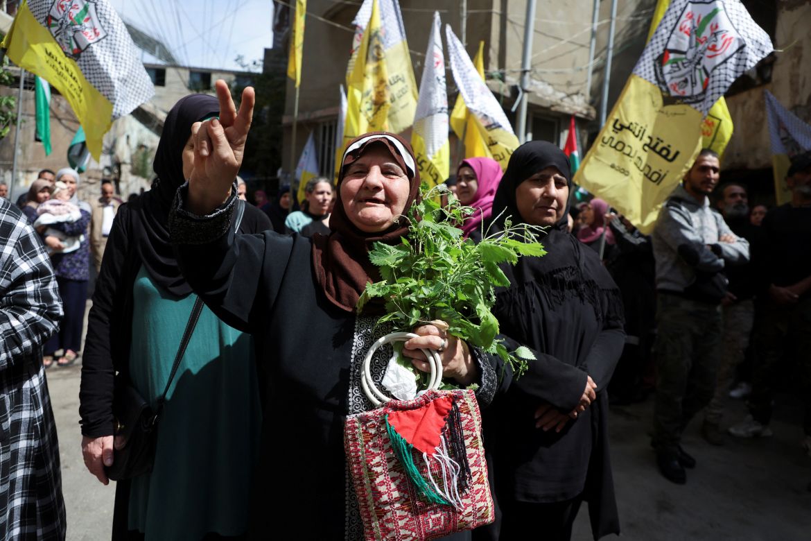 A Palestinian woman gestures during a march marking the annual al-Quds Day, (Jerusalem Day), at Burj al-Barajneh Palestinian refugee camp in Beirut