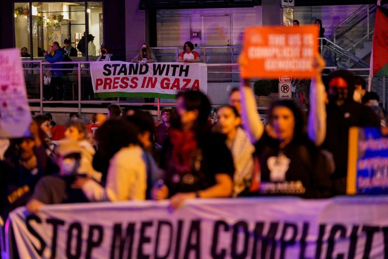 People demonstrate in support of Palestinians in Gaza during a protest near the annual White House Correspondents’ Association dinner in Washington, DC