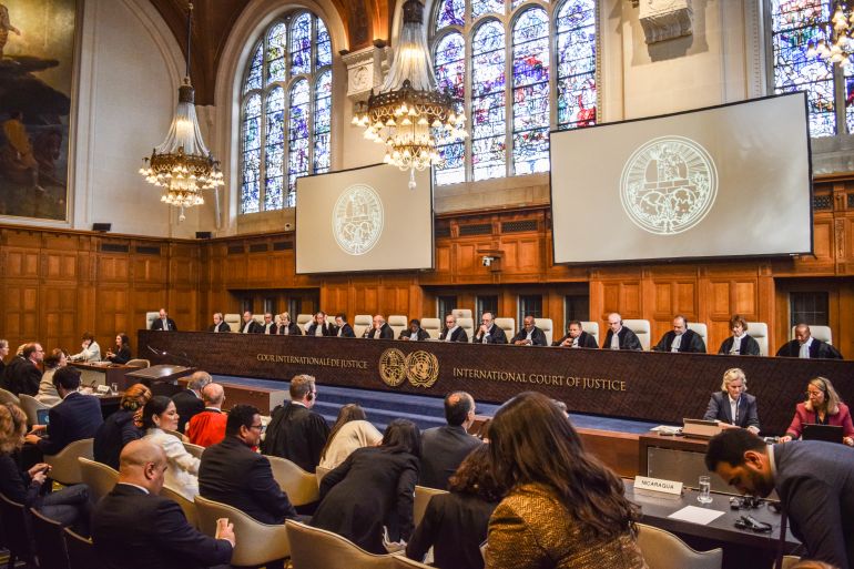 Judges entering the courtroom before public hearing on Nicaragua’s claim that Germany aids Israel’s ongoing genocide in the besieged Gaza Strip at the ICJ in the Netherlands on April 8, 2024