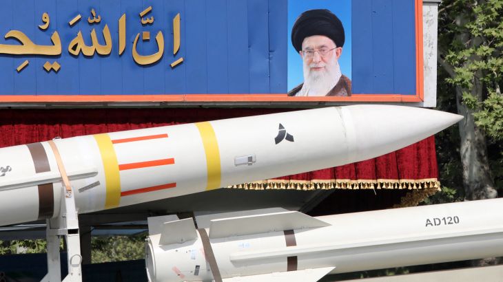 An Iranian military truck carries parts of a Sayad 4-B missile past a portrait of supreme leader Ayatollah Ali Khamenei during a military parade as part of a ceremony marking the country's annual army day in Tehran