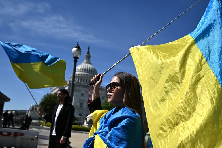Ukraine activists wave the country's flag outside the US Capitol