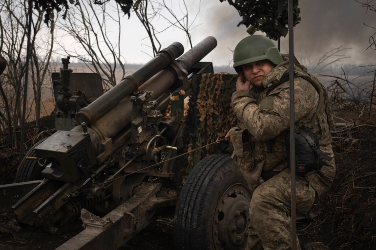 Ukrainian soldiers of the 71st Jaeger Brigade fire a M101 howitzer towards Russian positions at the frontline