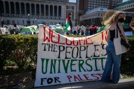 A sign is displayed in front of tents erected at a pro-Palestinian protest encampment at Columbia University in New York [Stefan Jeremiah/AP]