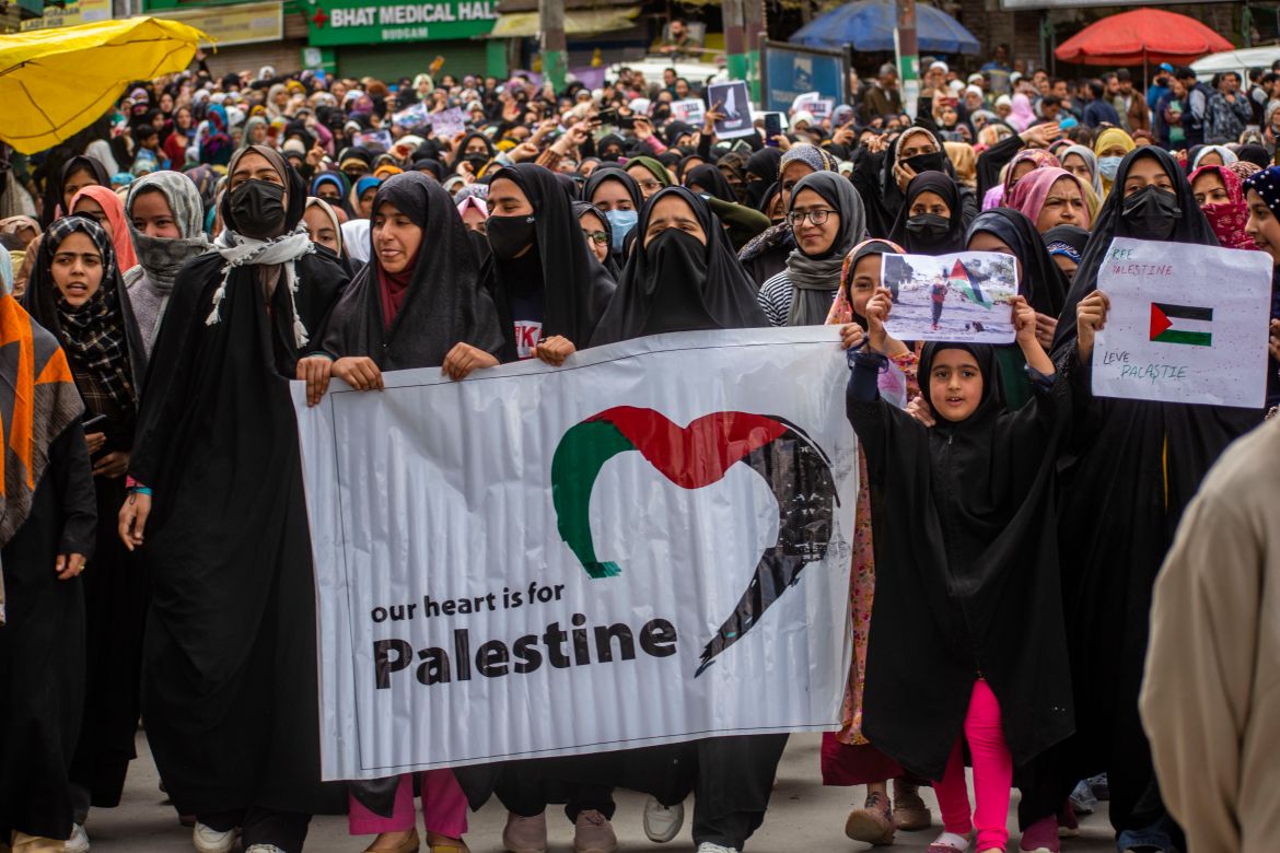 Kashmiri Shiite Muslim women hold banners and placards as they chant slogans against Israel and the U.S. during a protest against Israel's military operations in Gaza, on April 5, 2024, in Budgam, west of Srinagar,