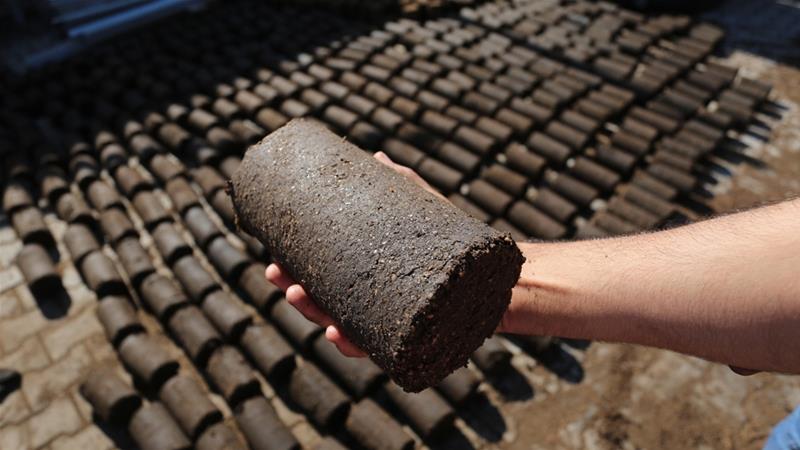 Jift - a waste product from olive oil harvesting - can be used for heating and cooking [Walid Mahmoud/Al Jazeera]