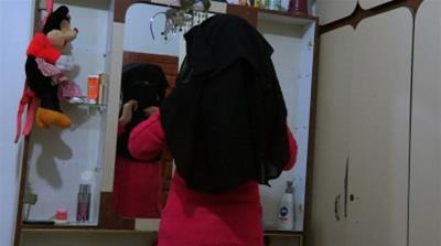 Shurooq Mousa's traditional Gaza Palestinian family hope she will embrace the niqab upon turning 15 - a societal expectation that does not convince her [Al Jazeera]