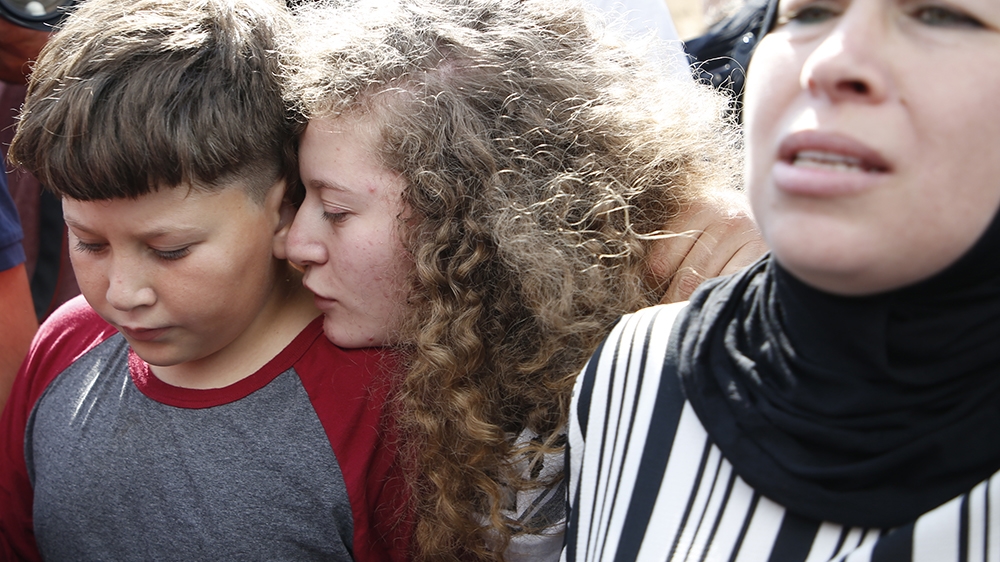 Ahed Tamimi and her mother were arrested in December 2017 [Abbas Momani/AFP] 