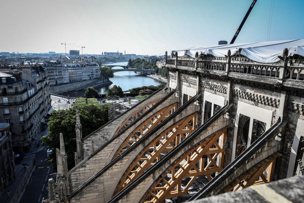 The building''s buttress is pictured during preliminary work on top of the Notre-Dame de Paris Cathedral three months after a major fire on July 17, 2019 in Paris. French MPs on July 16 approved a law