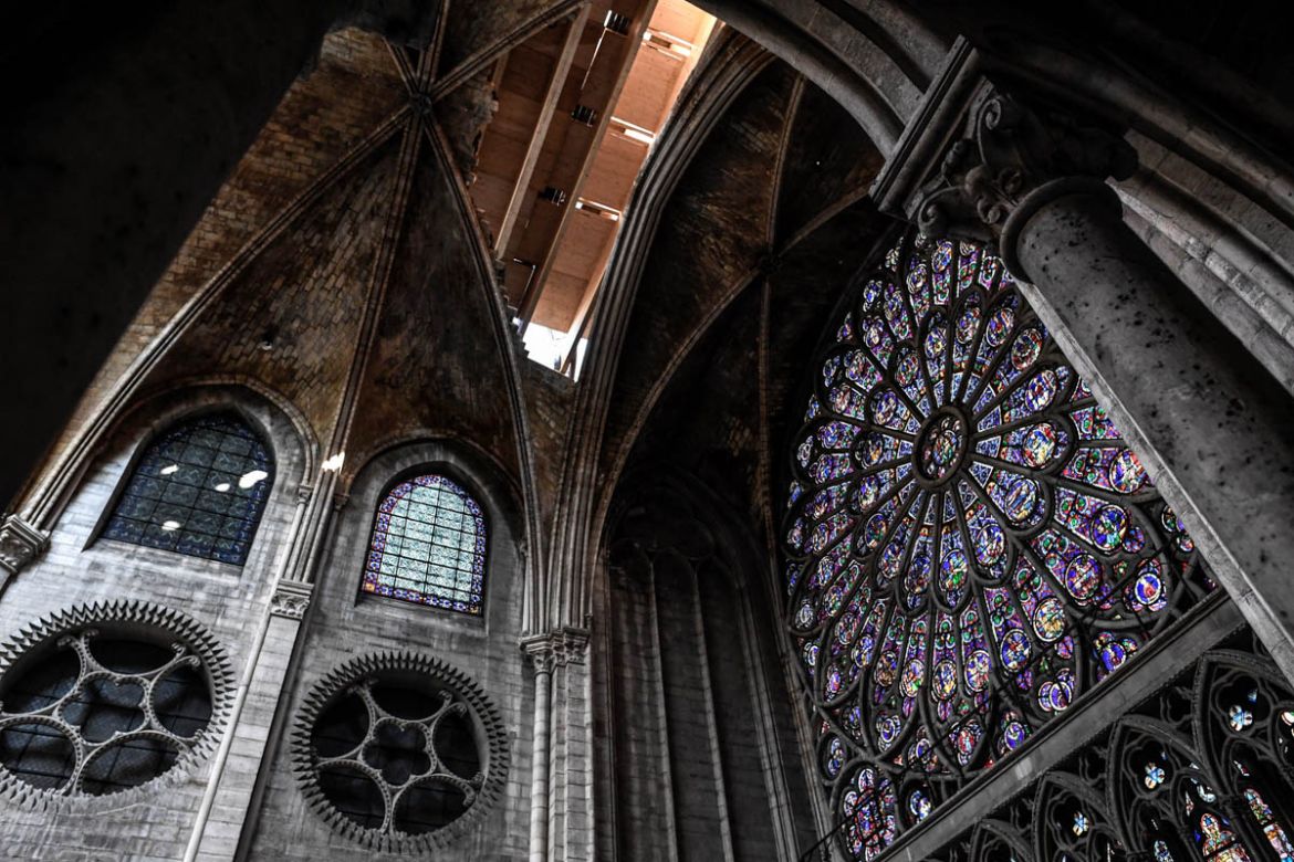 The rosette is seen during preliminary work in the Notre-Dame de Paris Cathedral three months after a major fire on July 17, 2019 in Paris. French MPs on July 16 approved a law on the reconstruction o