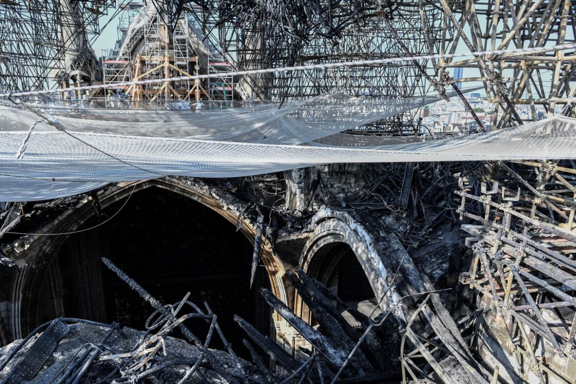 Parts of a destroyed ribbed vault and scaffolding are seen during preliminary work in the Notre-Dame de Paris Cathedral three months after a major fire on July 17, 2019 in Paris. French MPs on July 16