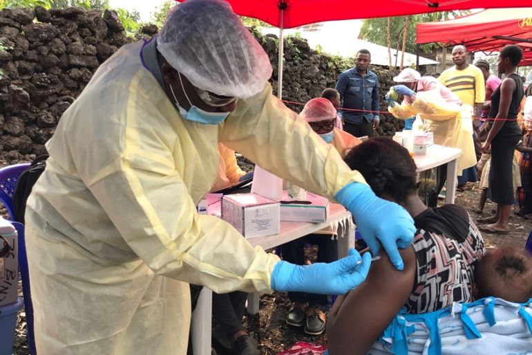 A Congolese health worker administers ebola vaccination to a resident at a centre in Goma