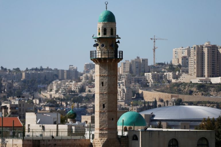The minaret of a mosque is seen in the Palestinian neighbourhood of Beit Safafa in Jerusalem