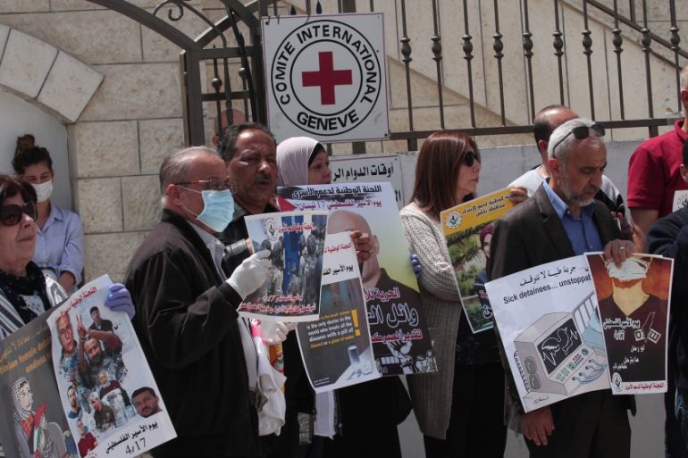 People gather to draw attention to circumstances Palestinian prisoners face in Israeli jails, in front of the headquarters of International Committee of the Red Cross in Nablus, West Bank on April 16,