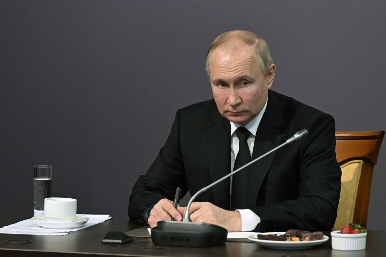 Russian President Vladimir Putin attends a meeting with local residents, veterans and representatives of civil society organizations to mark the 80th anniversary of a breakthrough in the siege of Leningrad during World War Two at the State Memorial Museum of the Defence and Siege of Leningrad in Saint Petersburg, Russia, January 18, 2023.