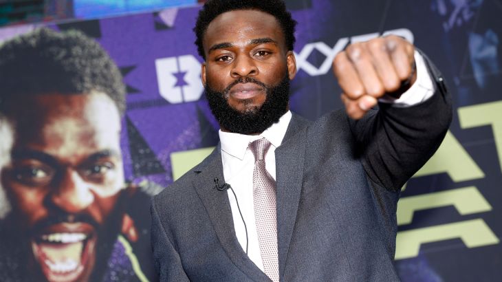 Joshua Buatsi holds out a fist during a press conference