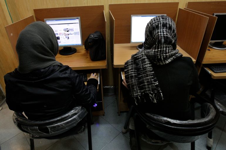 Iranian women use computers at an Internet cafe in central Tehran, Iran, Monday, Feb. 13, 2012. Many Iranian web users say their access to foreign email services such as Gmail, Yahoo mail and Hotmail appears to have been restored after a four day outage. (AP Photo/Vahid Salemi)
