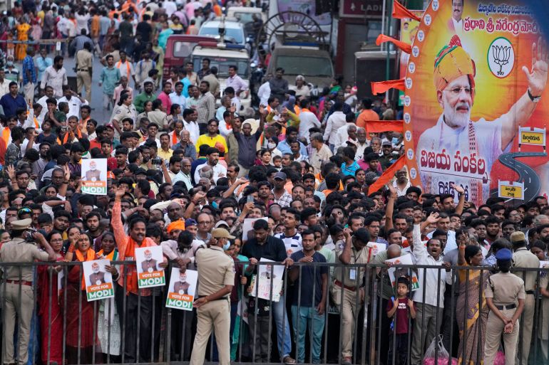 Supporters wait for Indian Prime Minister Narendra Modi to arrive at the venue of a Bharatiya Janata Party (BJP) election campaign rally in Hyderabad, India, Friday, March 15, 2024. (AP Photo/Mahesh Kumar A.)