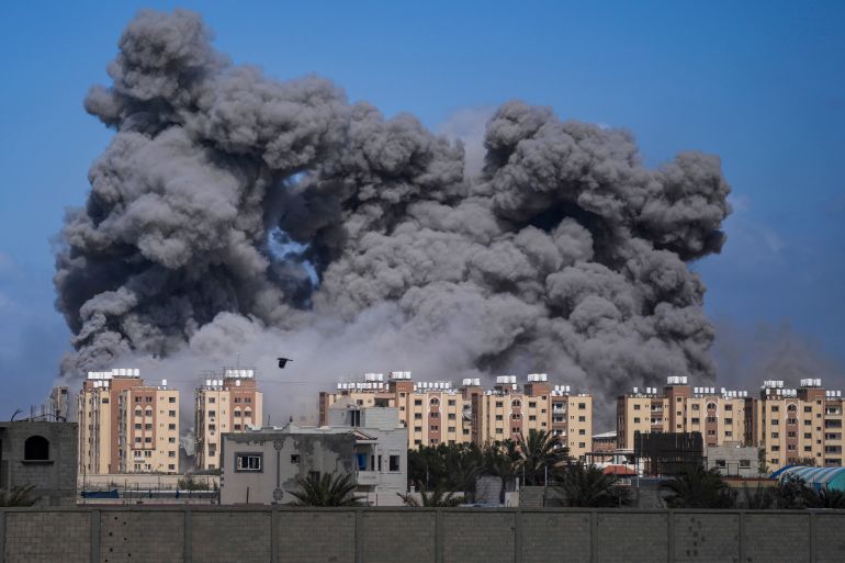 Smoke rises following an Israeli airstrike in the central Gaza Strip