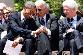 Then President Barack Obama, then-Vice President Joe Biden, and former President Bill Clinton are seen at a memorial service [File: Charles Dharapak/The Associated Press]